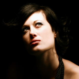 Woman looking to the heavens searching answers